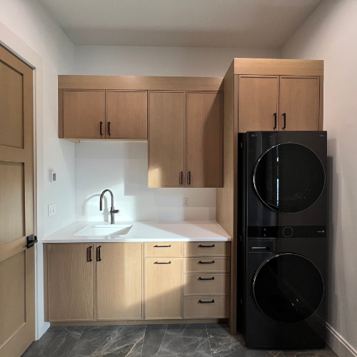 showroom laundry room, black dryer/washer, sink